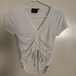 ‘Out from under’ UO white cropped tee